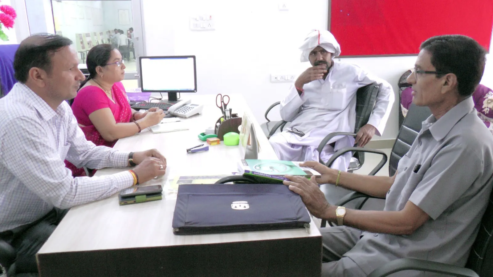 Institute staff meeting with visitors in the Navodya ITI office